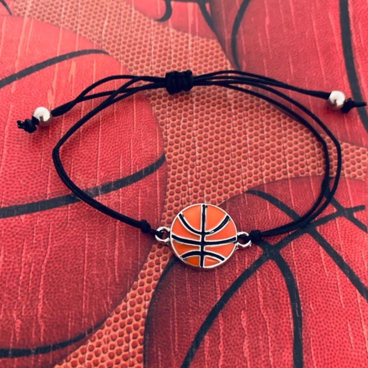 🏀BASKETBALL BRACELET - Basketball Charm on Adjustable Bracelet 🏀ADJUSTABLE - Basketball bracelet is adjustable. Easily Adjusts to Fit your Wrist 5" to 8" *will fit most wrists sizes small to large 🏀BASKETBALL GIFT - Looking for an inexpensive Basketball gift ? Got a birthday, holiday, or other special occasion coming up for the Basketball player in your life? This high quality yet inexpensive bracelet makes a great gift, whether for a friend, daughter, girlfriend, or teammate. 🏀DESIGNED & SO Basketball Bracelet, Adjustable String Bracelet, Basketball Jewelry, Basketball Accessories, I Love Basketball, Bola Basket, Preppy Jewelry, Infinity Jewelry, Basketball Gifts