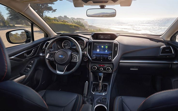 the interior of a car with dashboard and steering wheel view from driver's seat