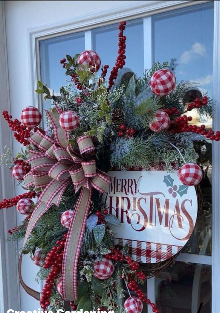 a christmas wreath hanging on the front door