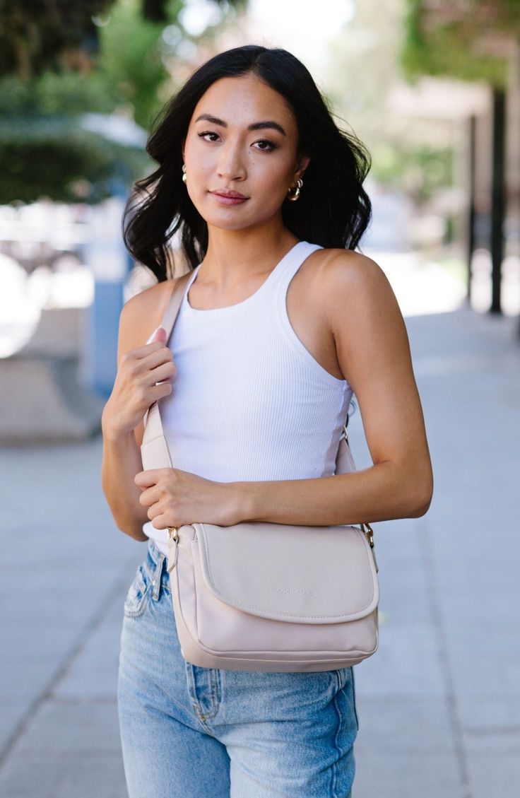 Sleek, durable vegan leather material? Check. A matching wallet? Check. Goes-with-everything colors and a chic silhouette? Double check! The Signature Crossbody is full of touches you'll love, like a back slip pocket with a magnetized closure for items you want to keep at the ready, three (that's right, three!) compartments to help you stay organized, and an attached fob chain for your keys and the matching wallet. Say goodbye to digging through your purse and hello to being the most organized p Timeless Accessories, Boutique Brands, Modern Chic, Signature Collection, Stay Organized, Staying Organized, Leather Material, Vegan Leather, Sleek