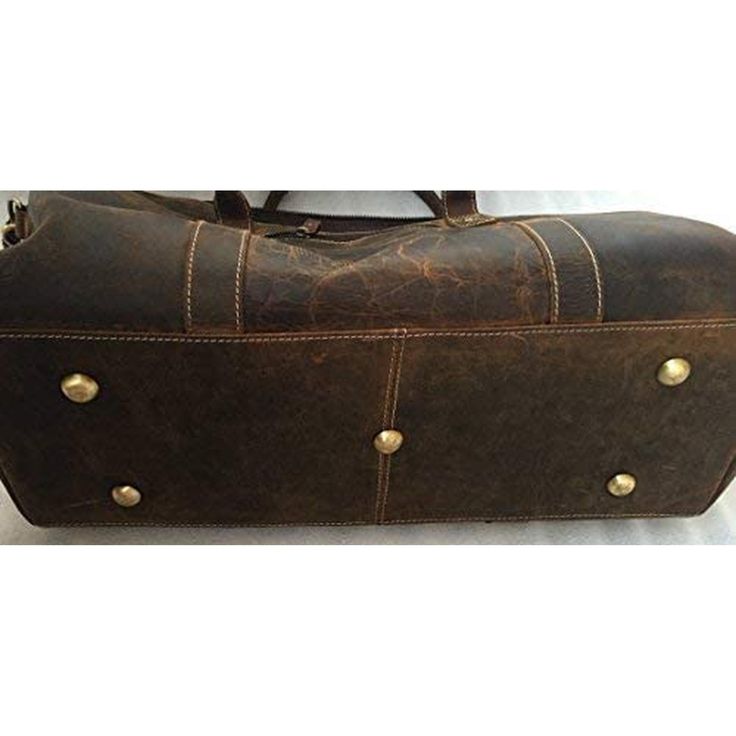 This 22 inch Distressed Buffalo Leather Travel Duffel Bag is made from the finest leather and handcrafted by experienced craftsmen. Vintage inspired design combined with the distressed leather gives a rich classy look. 100% Buffalo Leather Size: 22" L x 11" H x 7" YKK Metal Zippers Water Resistant Lining Leather Top Handle Adjustable Shoulder Strap Shipping & Returns Paypal Purchase Protection. Learn More Order Processing 1-3 business days. Ships from the United States Free standard shipping in Rugged Leather Duffle Bag, Rugged Brown Duffle Bag With Large Capacity, Rugged Rectangular Travel Bag, Womens Weekender Bag, Leather Weekender, Mens Travel Bag, Leather Duffle Bag, Leather Travel Bag, Leather Duffle