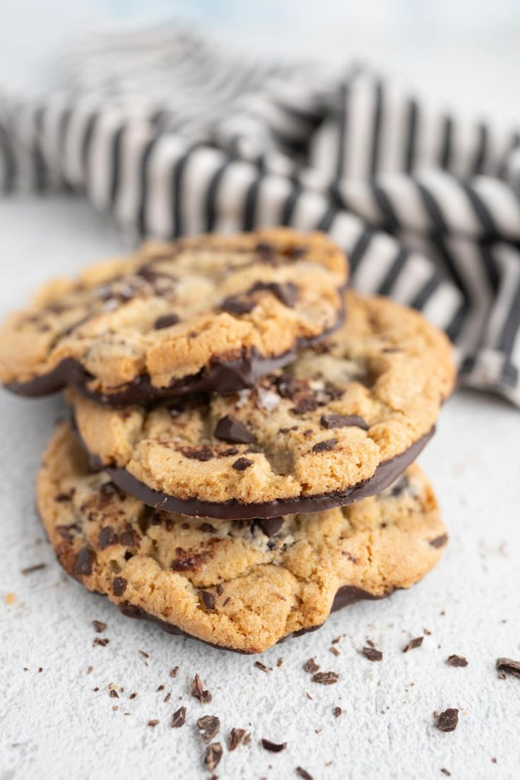 chocolate chip cookies stacked on top of each other