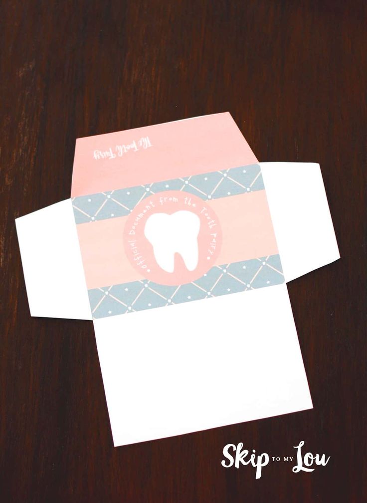 an open envelope with a tooth on it