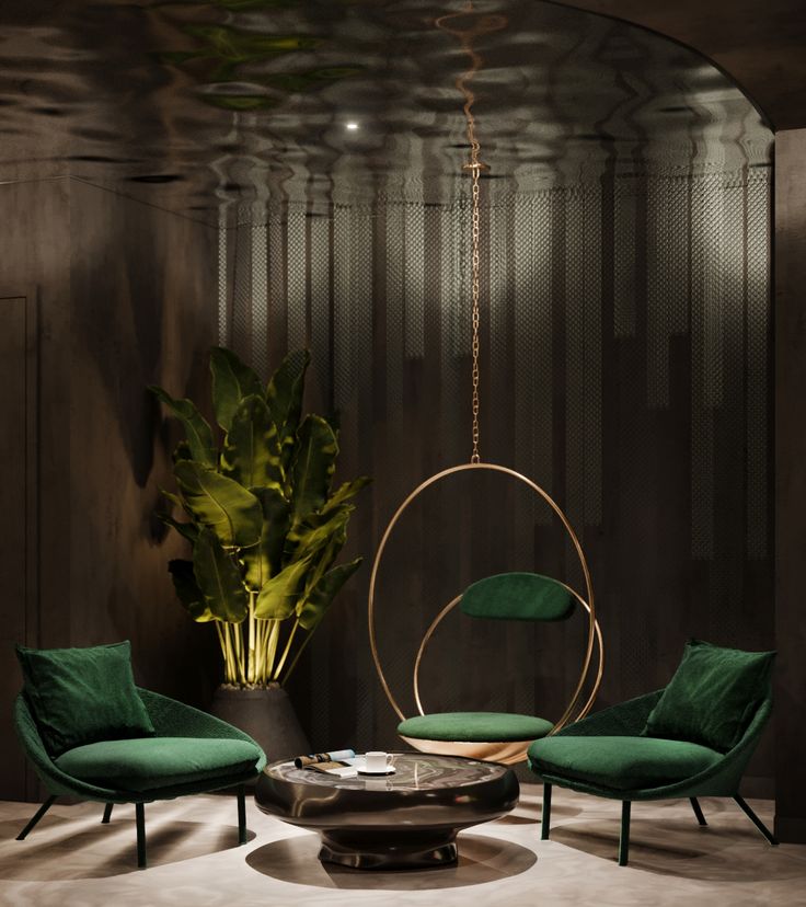 two green chairs and a round table in a room