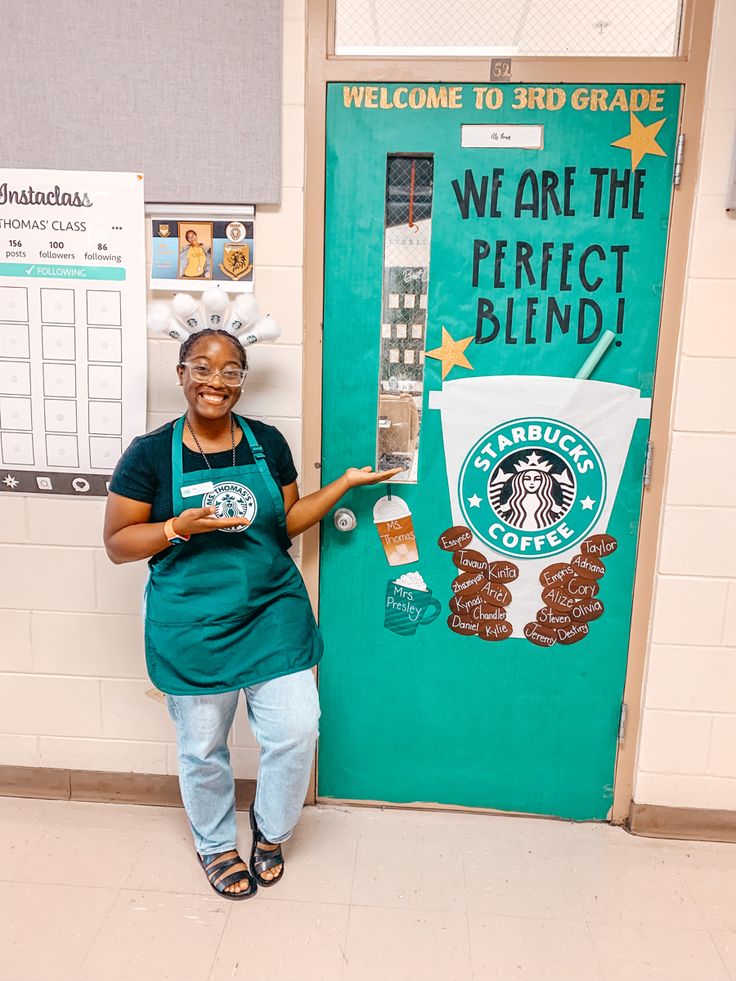 a woman standing in front of a green door with a sign on it that says we are the perfect blend