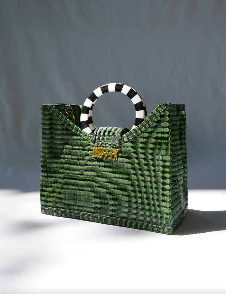 Explore our DSS 2 JFK City Bag Collection. This playful collection is a urban take on the popular woven Senegalese plastic tote bag. Each one is artfully hand-fashioned from up-cycled Senegalese floor mats, expressing raw and time-honored creativity. Rectangular bottom silhouette Toggle closure at top Slip pocket for easy phone accessMeasurements: W 26 cm x H 21 cm x D 11 cm. 10cm circumference circular plastic handle. Handcrafted in Senegal Adjustable detachable PU and polyester printed grosgra Lipstick Nails, Favorite Skincare Products, Bandana Scarf, Bag Collection, Nail Studio, Body Exfoliator, City Bag, Pocket Book, 50th Gifts