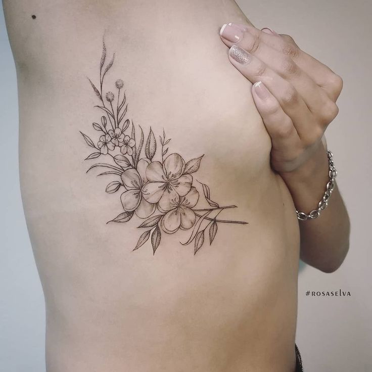 a woman's stomach with flowers on it