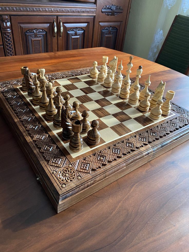 a wooden chess set on top of a table