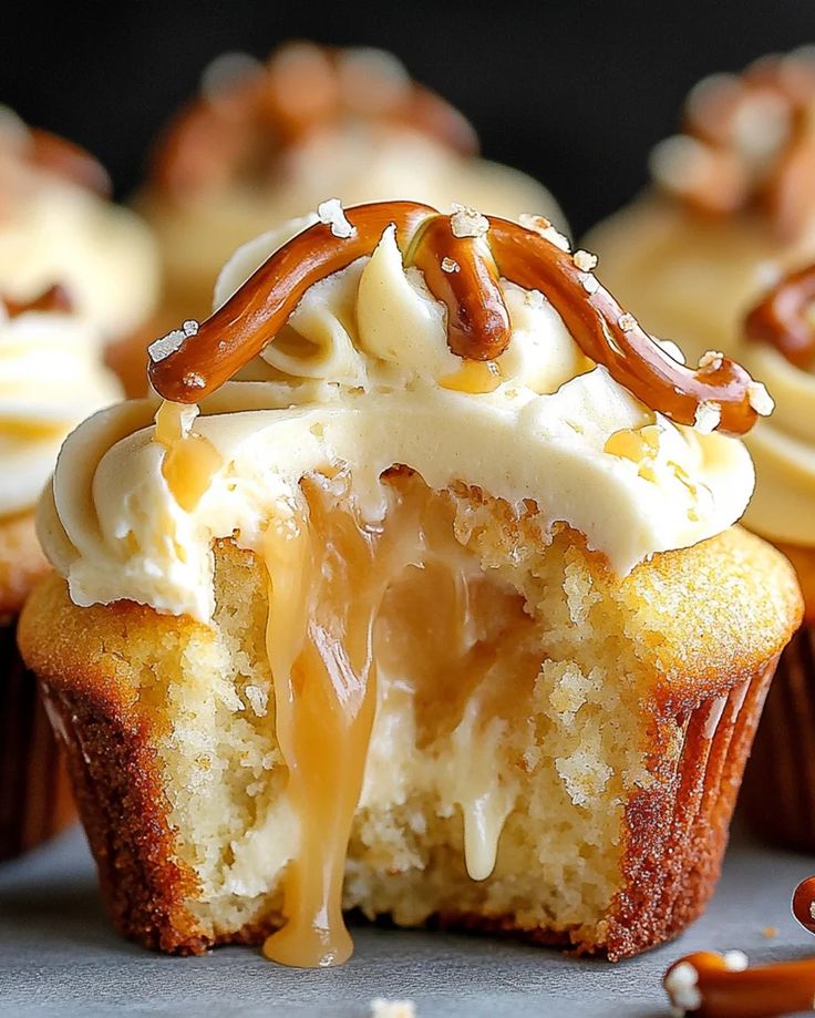 cupcakes with frosting and caramel drizzled on the top