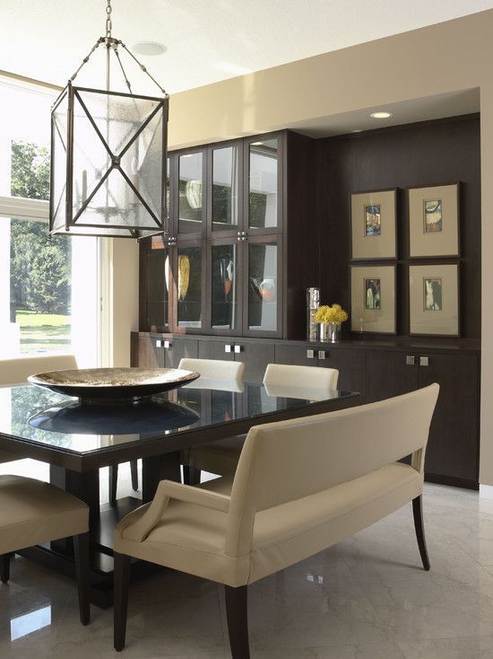 a dining room table with chairs and a chandelier