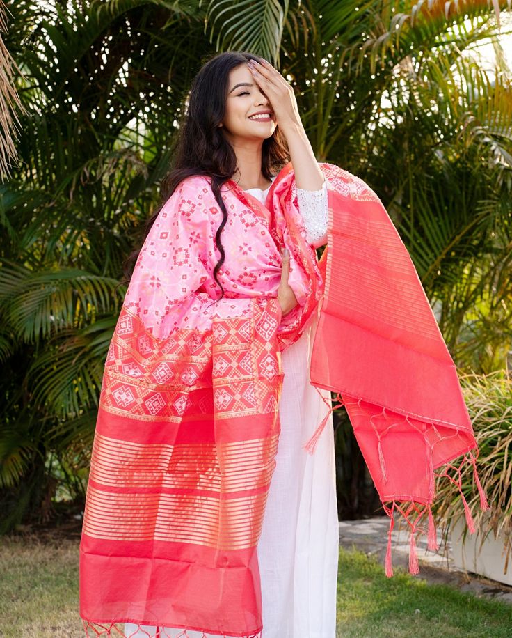 Celebrate any occasion in style with our silk blend patola dupatta. Crafted with care, each piece is elegant and unique. Enjoy the exclusivity of our limited edition collections and savor the slow fashion journey with us. Care: Consider dry cleaning or hand washing as preferable options, as machine washing may increase the likelihood of damaging the dupatta. Dupatta Length: Approx 2 meters * 0.5 metersUsage: Evening, Weddings, Festivals, Parties or any other special occasions.Perfect Gifting Solution: They also make ideal gifts for daughters, mothers, grandmothers, colleagues, partners, students, girlfriends, brides, bridesmaids, wives, wedding gifts, Ramadan, Eid gifts, Diwali Our soft and luxurious Patola cotton-silk dupatta, is perfect for any occasion. This dupatta is the perfect acces Traditional Pink Anarkali Set In Cotton Silk, Pink Cotton Silk Traditional Wear With Dupatta, Diwali Slub Silk Dupatta, Pink Cotton Silk Dupatta For Eid, Pink Cotton Silk Kurta With Self Design, Handloom Slub Silk Anarkali Set, Pink Anarkali Set With Dupatta For Traditional Ceremonies, Pink Straight Kurta Salwar Kameez For Traditional Ceremonies, Cotton Silk Dupatta With Bandhani Print For Wedding