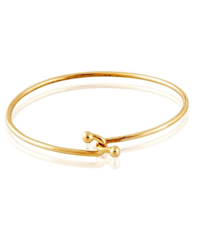 Our delicate handmade bracelet with the double ball closure is a favorite worn alone or with our Skinny Galaxy, Cabochon Spring Gold or Monogram Bangle. Standard size is 6.5. Please inquire if you need a custom size. Excellent gift for MEN too! Dimensions: 3.5MM Gold Wire 14kt Gold Handmade in Beverly Hills Hoop Bracelet With Polished Finish As A Gift, Adjustable Round Gold Bracelet In Modern Style, Modern Adjustable Gold Bracelet, Classic Adjustable Hoop Bracelets, Adjustable Yellow Gold Round Cuff Bracelet, Adjustable Round Gold Bracelet Stackable, Adjustable Yellow Gold Hoop Bracelets, Adjustable Round Gold Stackable Bracelet, Adjustable Stackable Round Gold Bracelet