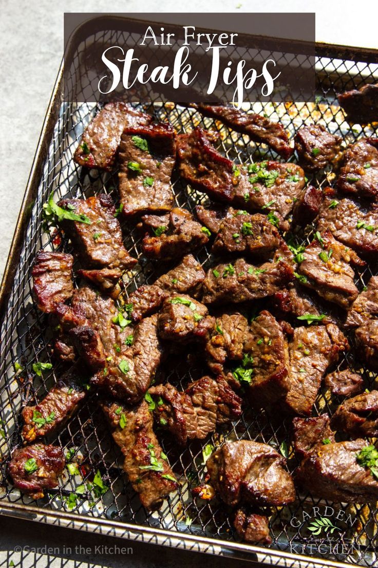 an air fryer with steaks on it and the words, air fryer steak tips