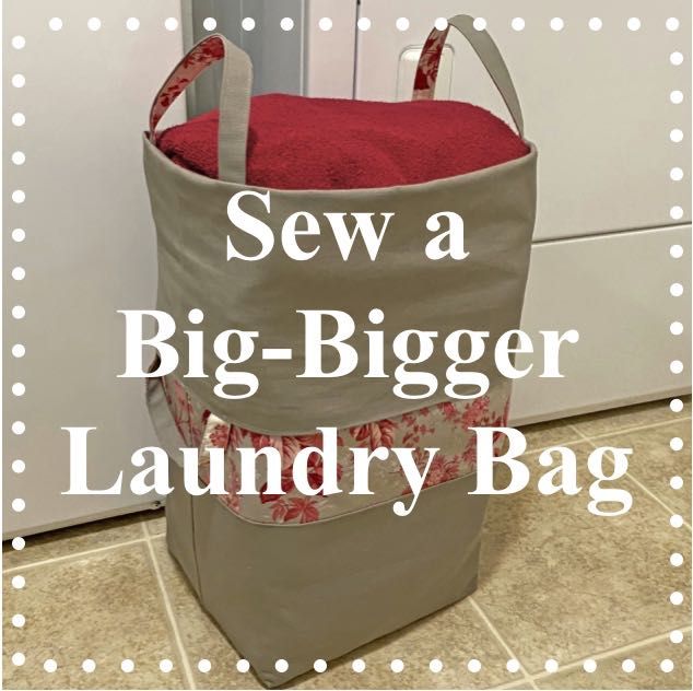 a laundry bag sitting on top of a kitchen floor with the words sew a big - bigger laundry bag