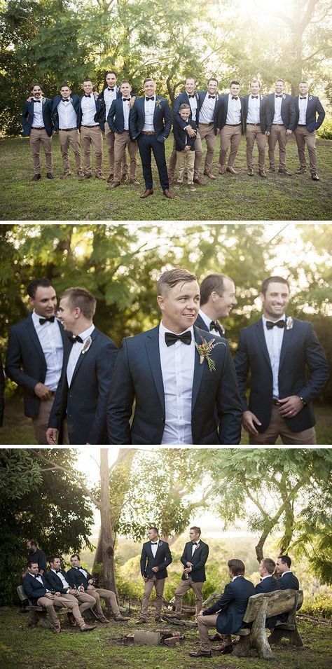 a group of men standing next to each other wearing suits and bow ties in front of trees