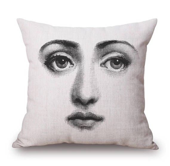 a pillow with an image of a woman's face on it