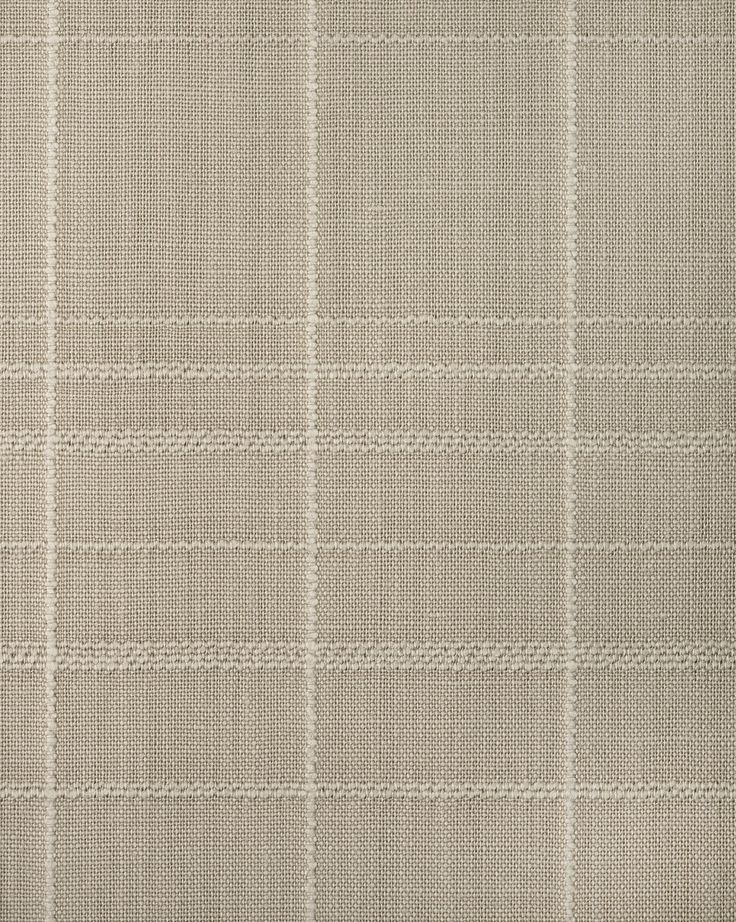 an upholstered beige and white checkered fabric