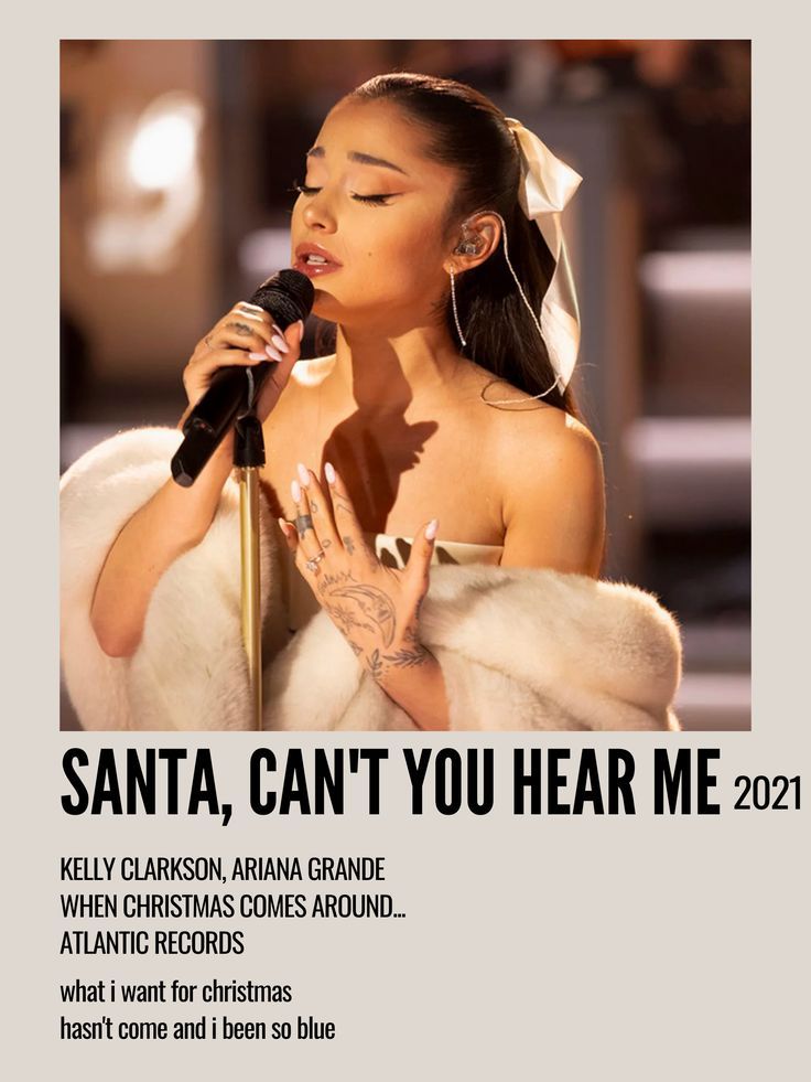 a woman singing into a microphone with the words santa, can't you hear me?