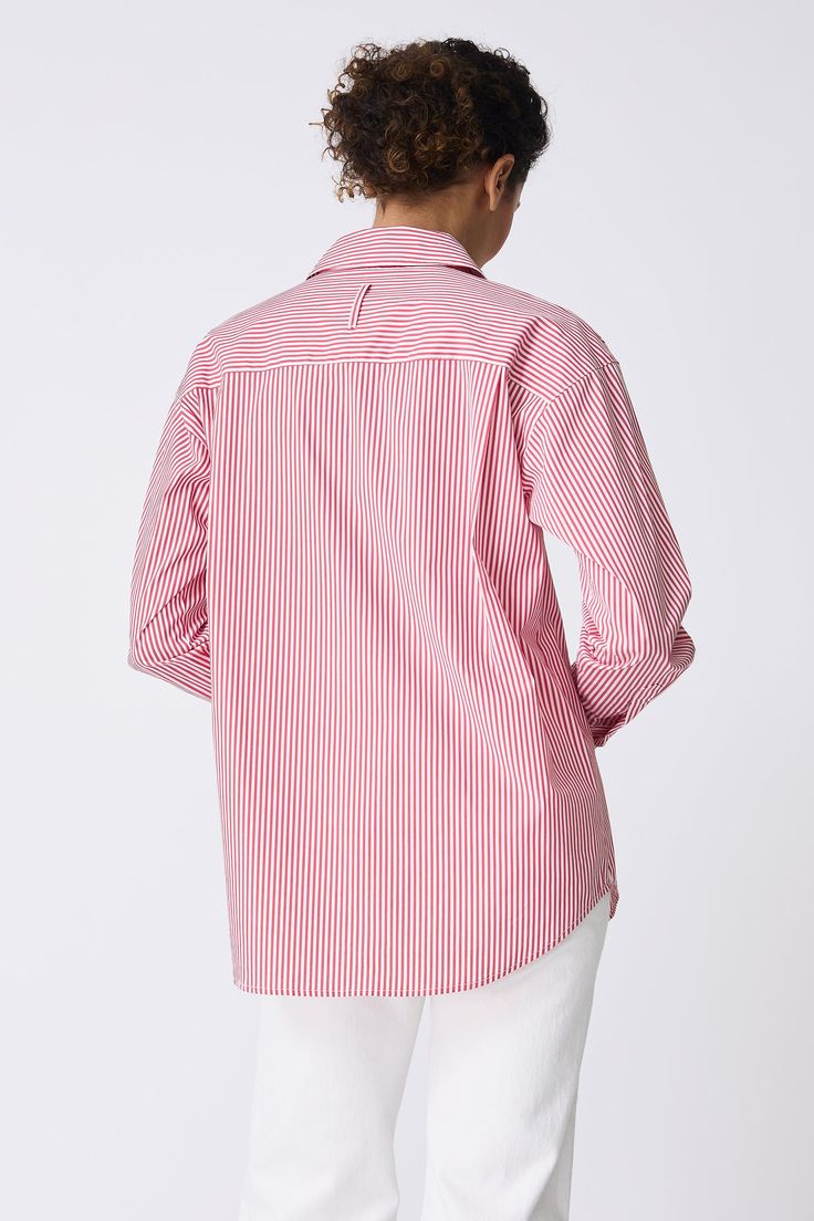 For a playful addition to your wardrobe, our Joni Boyfriend Shirt is the definition of cool tailoring. With a drop shoulder fit, looser body, and the perfect chest pocket, our Miami stripe stretch shirting is your Spring go-to staple. Pair it with your favorite jean or slim bottom. Drop shoulder fit, classic collar construction, center front button opening, chest pocket, classic cuff construction with sleeve placket, back yoke with double back pleat, signature loop detail - 75% Cotton, 22% Nylon