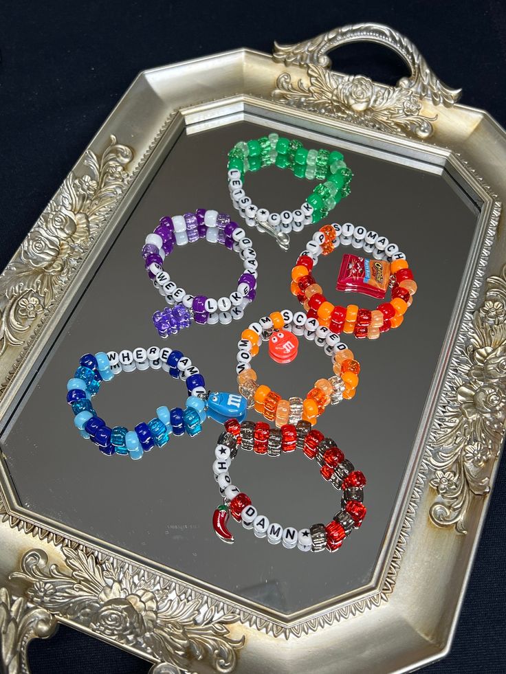 Show up to your next festival with unique and one-of-a-kind food themed kandis!! Some food items ( or utensils 🫣) are a essential for festivals. Show your love for your favourite substance by wearing it 24/7 during raves.  Each kandi is made with special care and high quality materials, ensuring the bracelet and charm survive all the headbanging and dancing at shows Purchase Options: 1. ONE Random Kandi 2. THREE Random Kandis 3. FIVE Random Kandis  4. Gummy Bear CUSTOM Kandi (put down colour preference and message) 5. M&M CUSTOM Kandi (put down colour preference and message) 6. Chili Pepper CUSTOM Kandi (put down colour preference and message) 7. Cheetos CUSTOM Kandi (put down colour preference and message) 8. Spoon CUSTOM Kandi (put down colour preference and message) Rave Candy Bracelets Hippie, Edc Kandi Bracelets, Funny Kandi Bracelets, Matching Kandi Bracelets, Rave Kandi Bracelets, Funny Cover Photos, Kandi Charms, Kandi Bracelets Rave, Festival Kandi