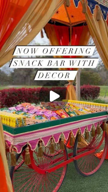 an old fashioned cart is decorated with colorful decorations and draping to match the color scheme