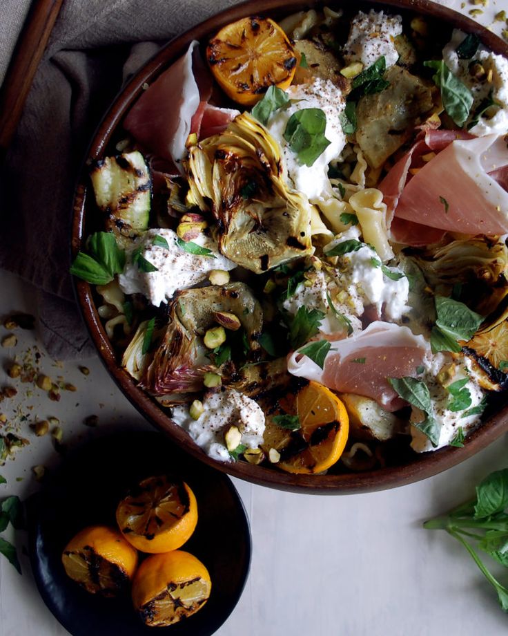 a wooden bowl filled with lots of food