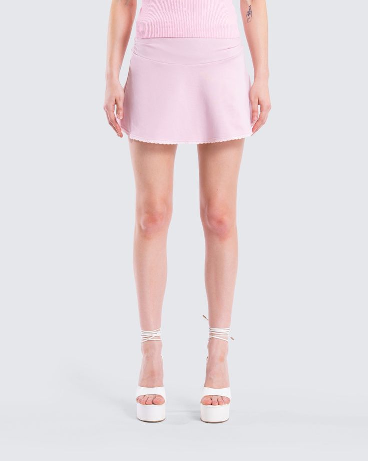 Embrace your flirty side in this pink mini skirt 💕 Made from stretch jersey and complete with a foldover waistband, a picot lace trim on the hem, and an invisible side seam zipper, this mini is the perfect sweet and sassy staple 😌 Flirty Stretch Swim Skirt For Spring, Spring Fitted Ruffled Swim Skirt, Spring Ruffled Fitted Swim Skirt, Spring Fitted Swim Skirt With Ruffles, Fitted Ruffled Swim Skirt For Spring, Spring Ruffled Stretch Swim Skirt, Stretch Mini Hem Skort For Spring, Spring Stretch Ruffled Swim Skirt, Fitted Ruffled Mini Tennis Skirt