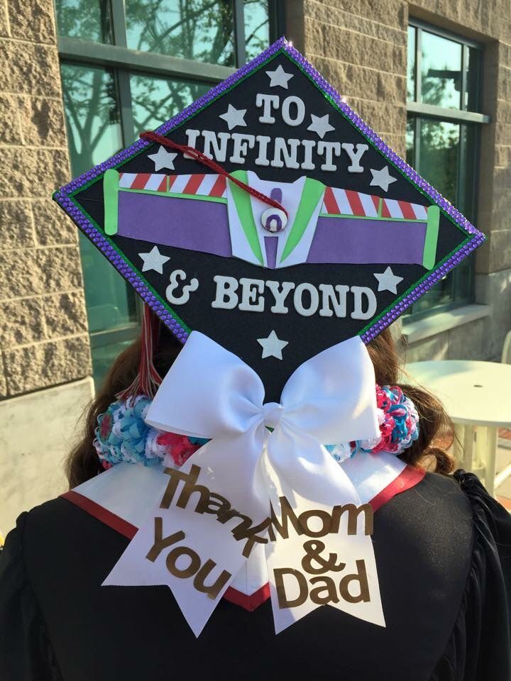 a person wearing a graduation cap that says to infinitity and beyond with ribbons around their neck