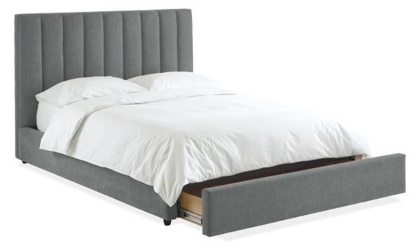 a bed with a gray headboard and foot board is shown in front of a white background