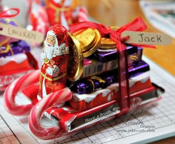 some kind of candy cart sitting on top of a table next to other candies