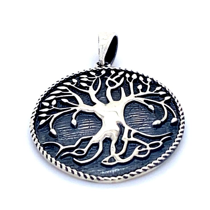 This remarkable tree of life pendant radiates old-world charm. An enchanting pendant that stands out on its own with its darkened finish. The tree of life symbolizes the interconnectedness of everything, especially the spiritual with the ethereal and earthly. The intricate artistry of this pendant is a mystical addition to any jewelry collection. Materials: .925 Sterling Silver Approximately 1.25" long and 1" wide Symbolic Tree Of Life Round Pendant Jewelry, Bohemian Tree Of Life Pendant Jewelry, Bohemian Tree Of Life Round Jewelry, Bohemian Tree Of Life Jewelry For Meditation, Bohemian Jewelry With Tree Of Life For Meditation, Bohemian Jewelry For Meditation With Tree Of Life, Bohemian Tree Of Life Round Pendant Jewelry, Bohemian Tree Of Life Round Pendant Necklace, Bohemian Necklace With Tree Of Life Round Pendant