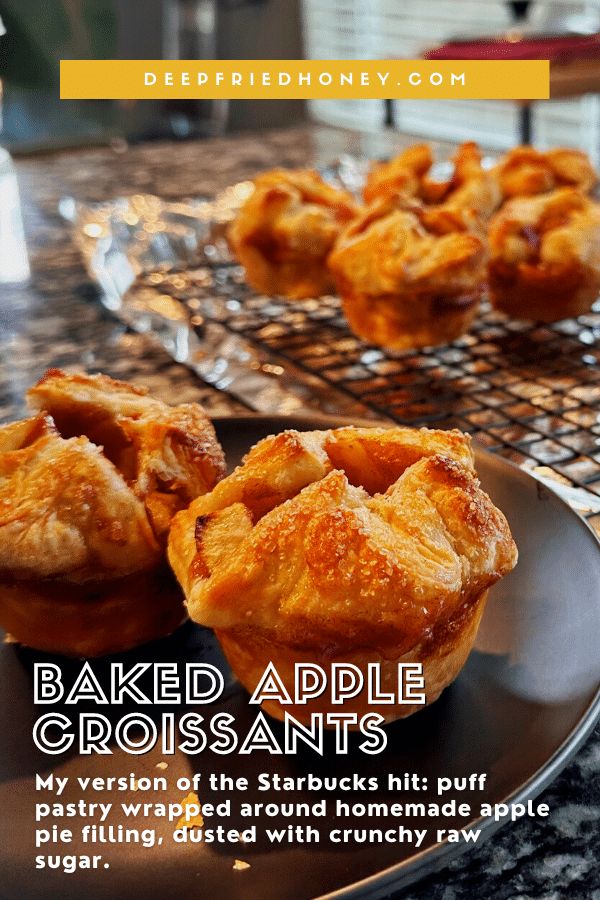 baked apple croissants on a plate with text overlaying the image