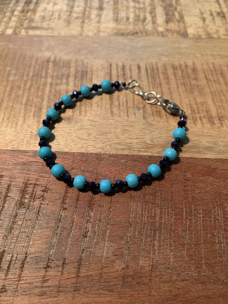 This is a simple bracelet for everyday wear. Everyday Turquoise Nickel-free Bracelets, Elegant Blue Friendship Bracelets With Round Beads, Minimalist Blue Beaded Bracelets, Blue Beaded Minimalist Friendship Bracelets, Elegant Blue Handmade Bracelets, Elegant Handmade Blue Friendship Bracelets, Elegant Adjustable Blue Crystal Bracelet, Elegant Blue Beaded Friendship Bracelets, Trendy Adjustable Blue Crystal Bracelet