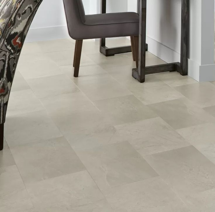 a dining room table and chairs with white tile flooring