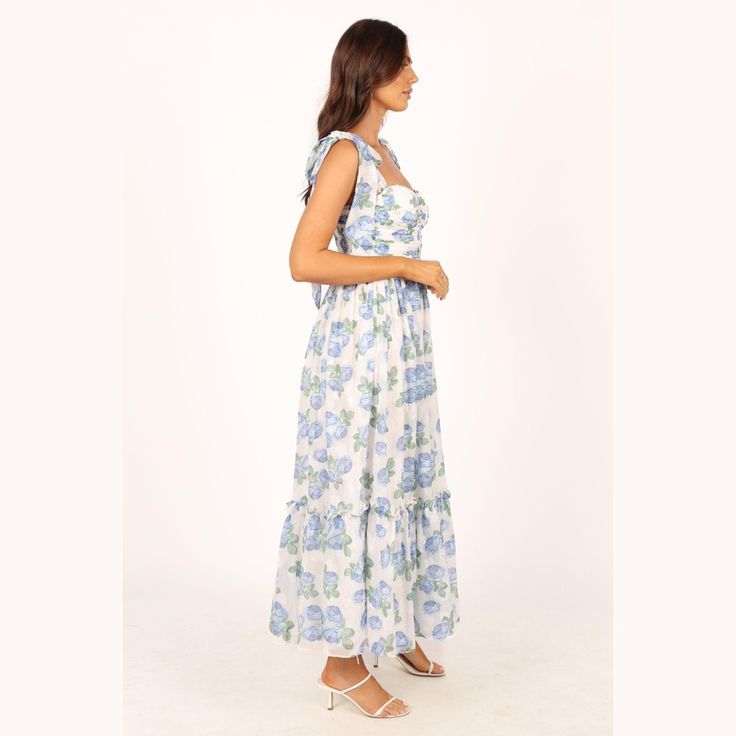 Make a statement in this dreamy dress! This midi dress features a sweetheart neckline, tie close shoulder straps, and padded cups in the bust for extra support and to top it all off, this dress is made with a blue floral chiffon overlay for an elegant touch. Perfect for any special occasion. Sundress With Ruffles And Sweetheart Neckline For Garden Party, Brunch Sundress With Sweetheart Neckline, Spring Midi Dress With Sweetheart Neckline And Adjustable Straps, Sweetheart Neckline Sundress For Brunch, Ruffled Straps Dresses With Tie Straps And Fitted Bodice, Blue Maxi Dress With Tie Straps For Garden Party, Sundress With Sweetheart Neckline And Knotted Straps, Sweetheart Neckline Midi Dress With Adjustable Straps For Brunch, Blue Maxi Dress With Sweetheart Neckline For Garden Party