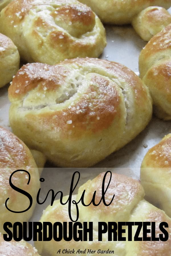 some very tasty looking breads on a tray with the words, sinful sourdough pretzels