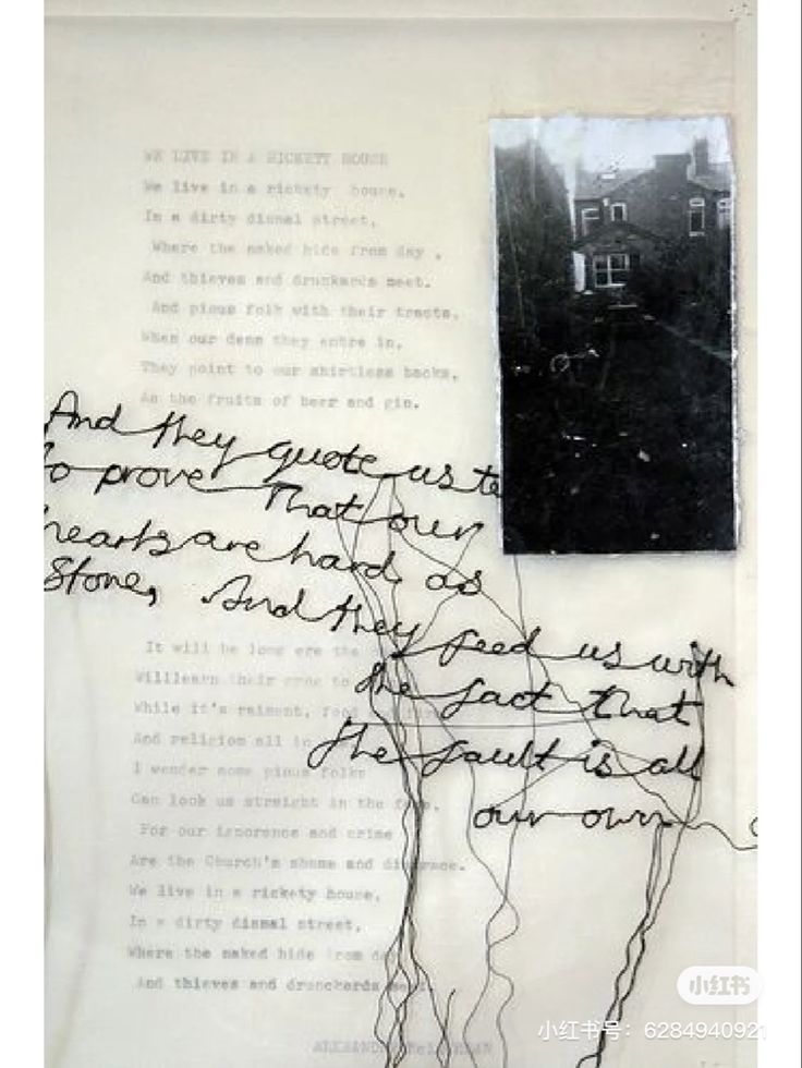 a piece of paper with writing on it and an image of a house in the background