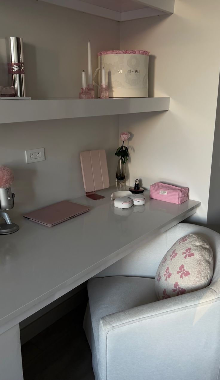 a white chair sitting in front of a desk