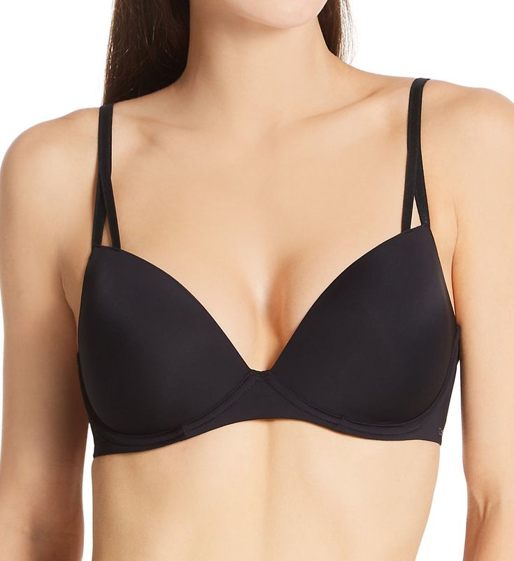 Seamless demi bra has underwire cups with bump pad to keep you lifted and supported. The inner perforations in cup allow for better air flow. Convertible straps are adjustable and can be worn classic or crossback. Made of nylon and elastane. Contour/t-shirt bra has seamless underwire cups that support the breasts for a smooth, rounded shape. Medium graduated bump pad in cups lifts the breast and provides a rounder, fuller shaper. Seamless cups are perforated for breathability. Deep plunge front Classic Padded Solid Bra, Classic Padded Solid Color Bra, Black Fitted Nursing Bra With Removable Cups, Fitted Black Nursing Bra With Removable Cups, Elegant Calvin Klein Bra With Built-in Support, Elegant Calvin Klein Underwire Bra, Calvin Klein Elegant Underwire Bra, Black Full Cup Bra With Removable Cups, Calvin Klein Underwire Bra With Padded Cups