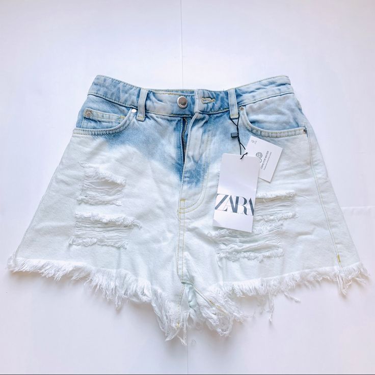 Zara High-Waist Shorts With A Five-Pocket Design. Ripped Detailing At The Front And Frayed Hems. Zip Fly And Top Button Fastening. Color: Light Blue Join Life Materials: 100% Cotton Brand New With Tag. Size 00 Fit For Xs White High Rise Bleached Bottoms, High Rise Bleached White Bottoms, High Rise White Bleached Bottoms, Trendy Bleached Denim Bottoms, White Ripped Jeans For Summer, White Denim Jean Shorts With Frayed Hem, Summer Ripped Acid Wash Jeans, Summer Acid Wash Ripped Jeans, Light Wash Jean Shorts With Pockets For Summer