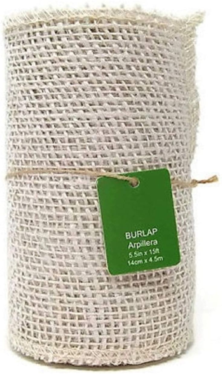 a roll of burlap is wrapped in jute and has a green tag on it