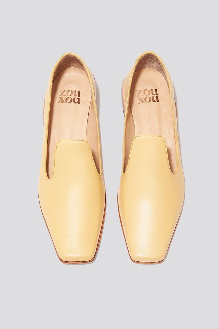 The Olympia Loafer is a babouche-inspired loafer featuring a square boxy toe, a cut-away upper, and a stacked leather heel. Olympia sets itself apart from the typical loafer thanks to its elegant lines. Style the Olympia loafer with suiting for a modern work look or with slip dresses for an elevated, relaxed evening look. Who it’s for: The woman who loves loafers and is looking for a fresh new shape to experiment with. Handmade in Argentina Kidskin leather upper with vegetable tanned leather lin Classic Slip-on Loafers With Sculpted Heel, Classic Slip-on Flats With Square Toe, Chic Square Toe Loafers With Stacked Heel, Chic Loafers With Stacked Heel And Square Toe, Business Loafers With Stacked Heel And Square Toe, Spring Slip-on Loafers With Sculpted Heel, Classic Loafers With Stacked Heel For Spring, Chic Almond Toe Loafers With Stacked Heel, Chic Loafers With Contrasting Heel Counter