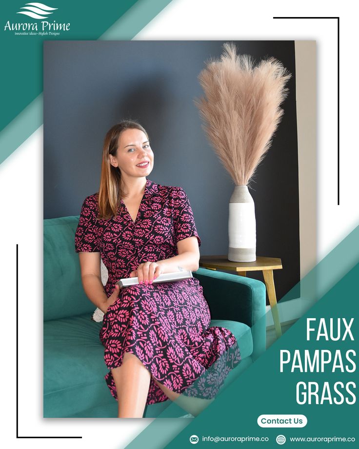 a woman sitting on top of a couch next to a vase with feathers in it