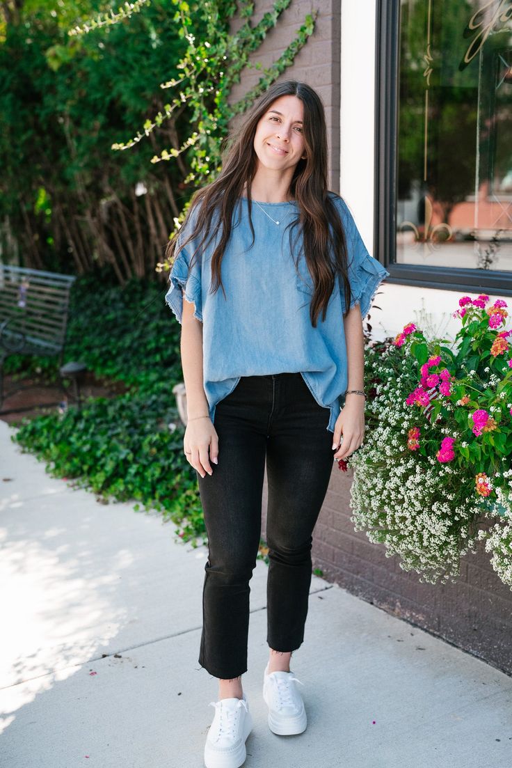 The Emily Denim Top is a casual, light blue denim top that offers a relaxed, laid-back vibe perfect for everyday wear. The fabric is soft and lightweight, making it comfortable and breathable for any season. The top features a simple round neckline and a single chest pocket, adding a touch of classic style. The slightly oversized fit and curved hemline enhance its relaxed look, making it easy to pair with jeans, shorts, or leggings. The Fabric: 100% Tencil Product details: Casual, relaxed fit. F Trendy Light Wash Denim Blouse, Casual Blouse For Brunch, Summer Denim Blue Tencel Tops, Everyday Blue Denim Top For Spring, Blue Denim Top For Everyday Spring Wear, Spring Everyday Blue Denim Top, Blue Short Sleeve Top With Frayed Hem, Denim Blue Crew Neck Top For Spring, Summer Washed Blue Tencel Tops