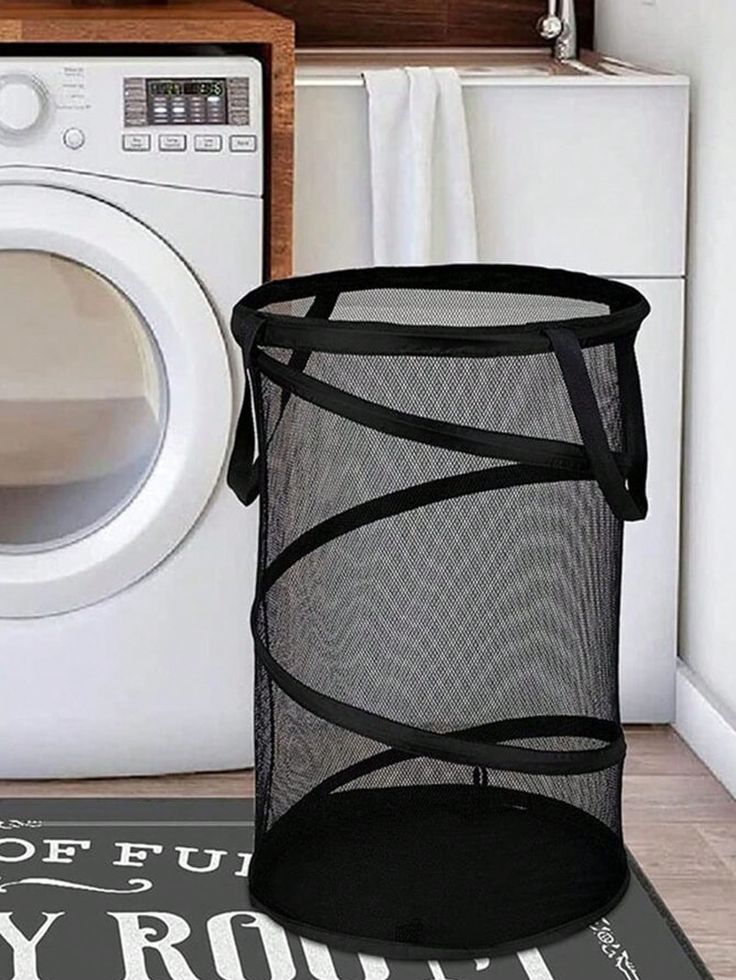 a laundry basket sitting next to a washing machine