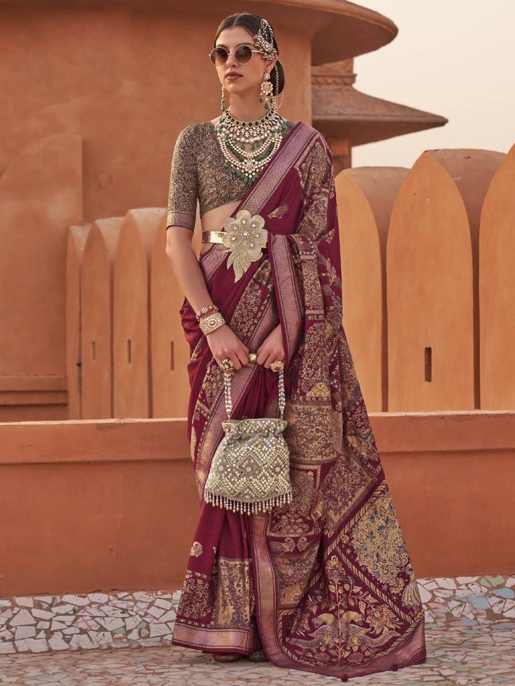 Introducing our gorgeous maroon digital printed silk wedding wear saree with a blouse, a stunning piece that is sure to turn heads and make you the center of attention. Made with maroon-colored silk material, this saree exudes elegance and sophistication. The intricate digital print work adds a touch of modernity to the traditional silhouette, making it a perfect choice for various occasions such as events, weddings, receptions, festivals, or any ceremony.
The digital print work showcases intric Wedding Wear Saree, Wine Print, Stitch Clothes, Blouse Designs Silk, Half Sleeve Blouse, Wear Saree, Silk Wedding, Blouse Material, Silk Sarees Online