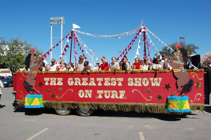 a parade float with people riding on it