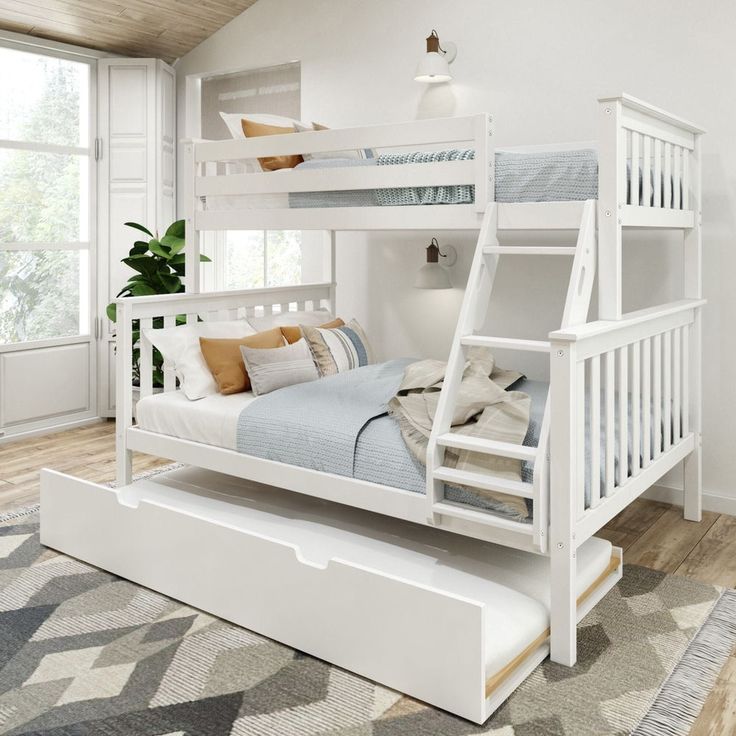 a white bunk bed sitting on top of a wooden floor next to a rug and window