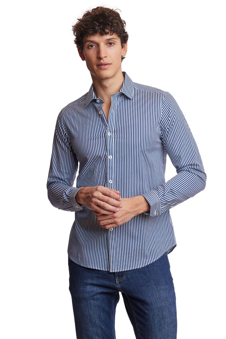 A classic slim spread collar shirt with navy stripes. The cotton stretch blend offers comfort all year round and can be worn with a wide range of clothing. PRODUCT DETAILS: style 6513W slim fit dress shirt spread collar printed fabric cotton stretch blend dry clean only imported Striped Cotton Dress Shirt For Semi-formal Occasions, Striped Cotton Shirt For Semi-formal Occasions, Semi-formal Striped Collared Shirt, Casual Striped Slim Fit Dress Shirt, Casual Slim Fit Striped Dress Shirt, Pinstripe Dress Shirt With Striped Collar In Cotton, Pinstripe Dress Shirt With Striped Collar, Pinstripe Shirt With Striped Collar, Pinstripe Cotton Dress Shirt With Striped Collar