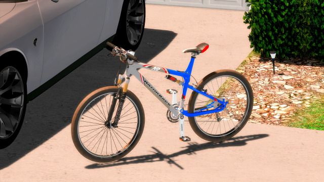 a blue bike parked next to a white car